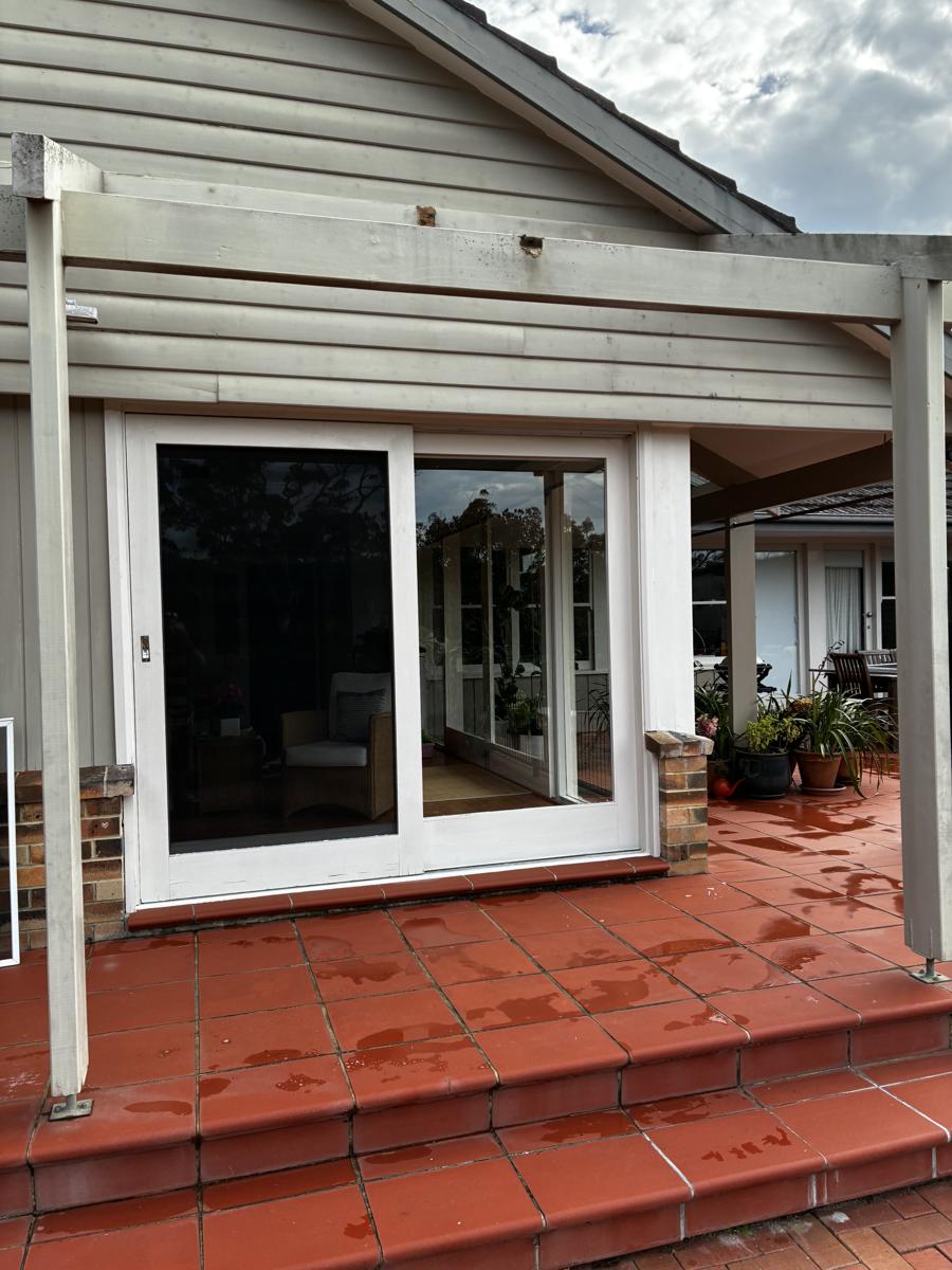 Clean sliding door onto a tiled patio
