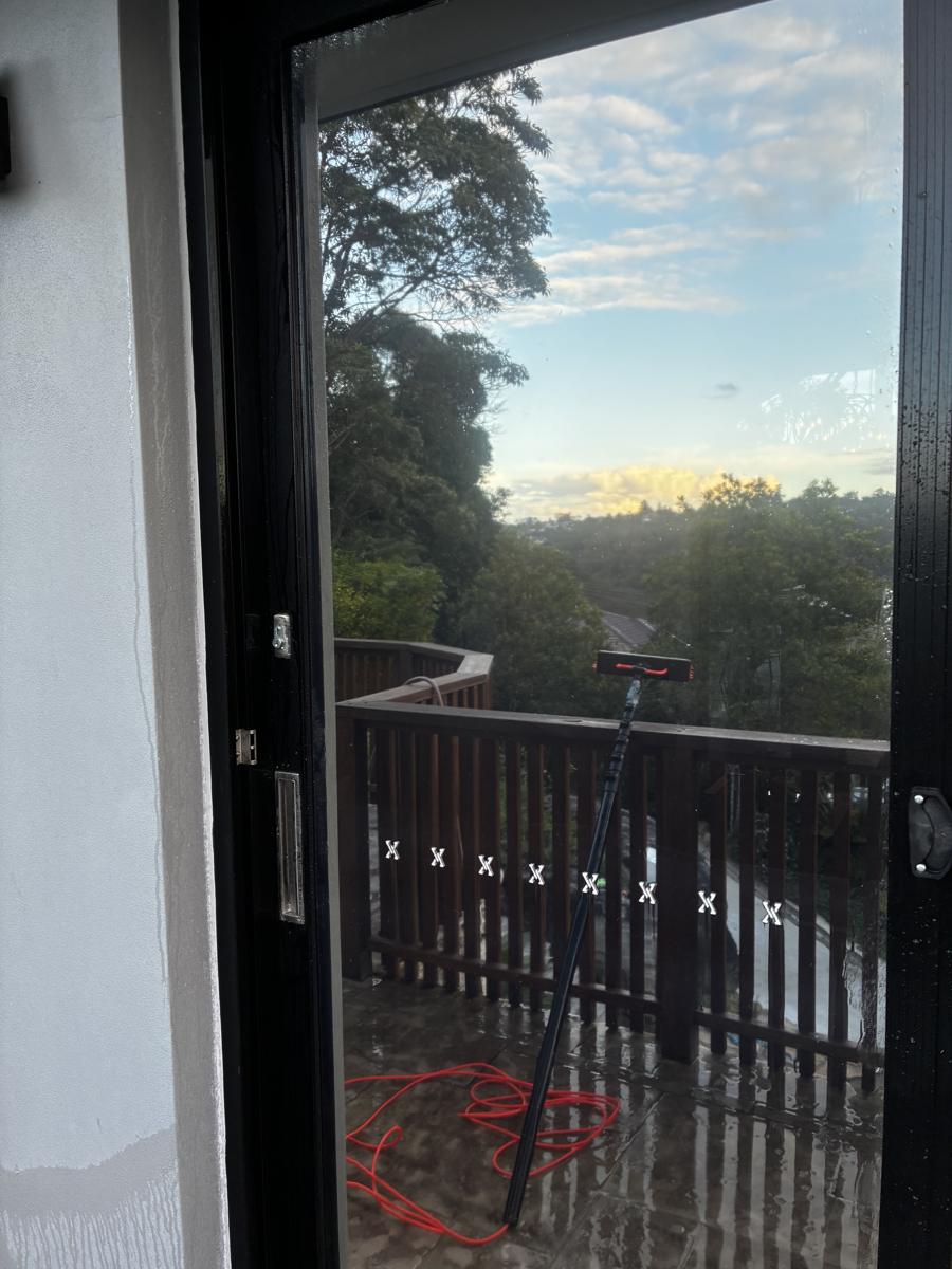 Clean sliding door with a treetop view