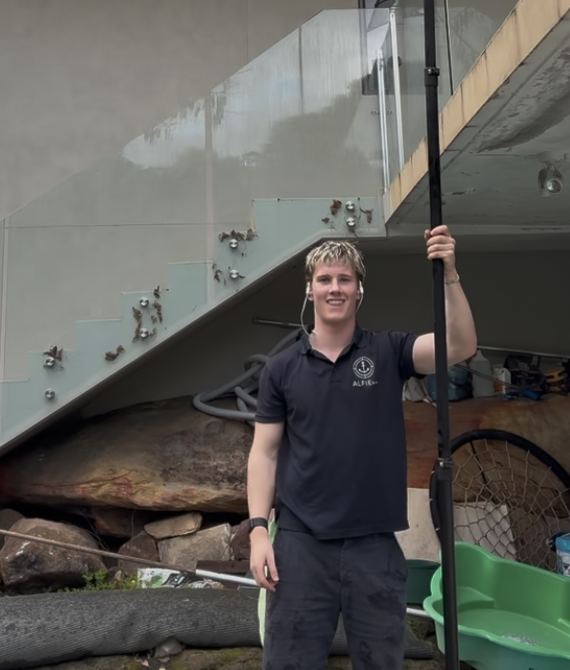 Hugh with his water-fed pole