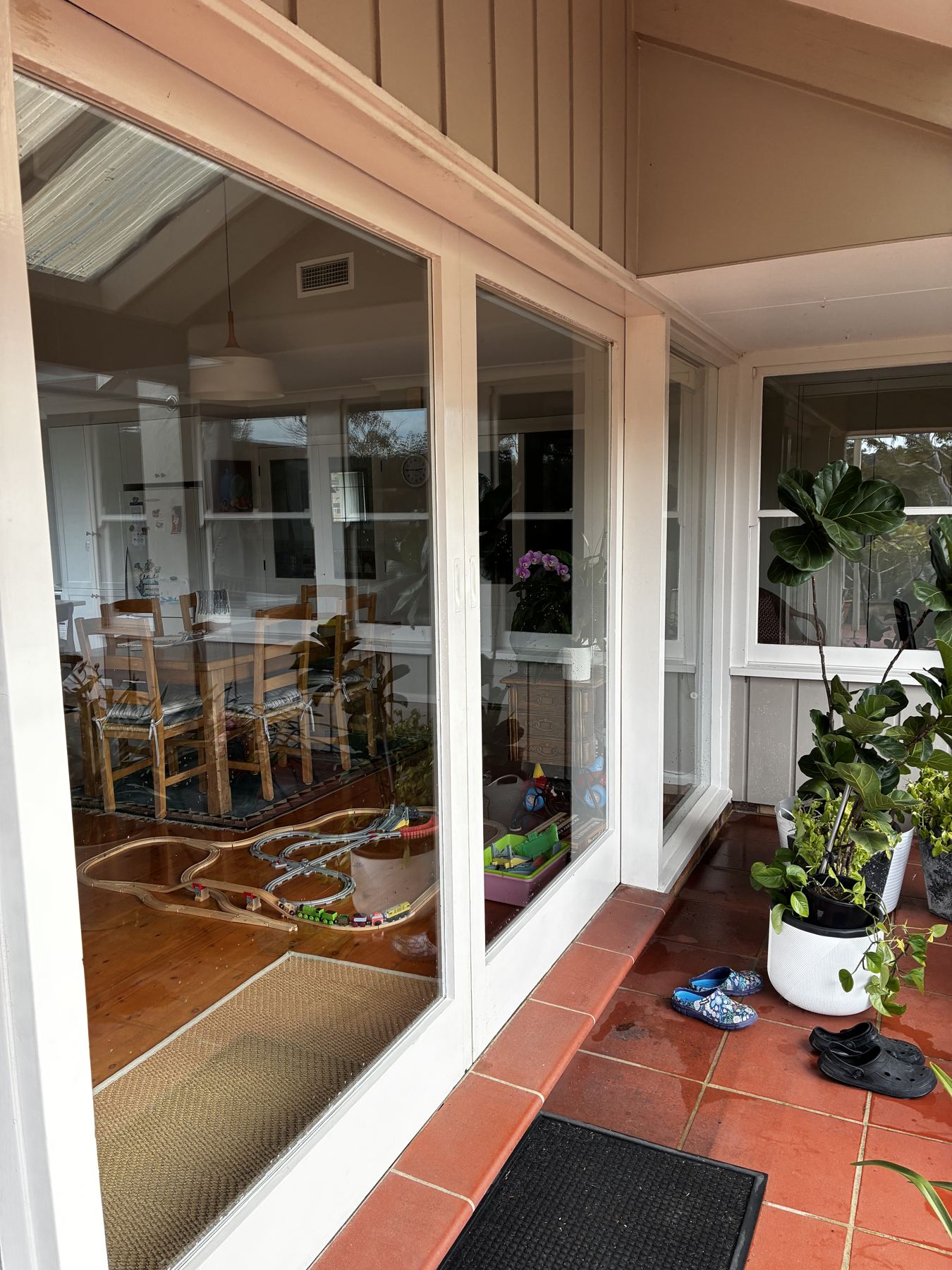 Clean glass doors on a weatherboard home